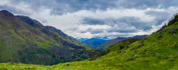 istock Panoramic view of snow capped southern alps in springtime 1448413706