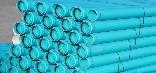 Stacks of blue PVC water pipes