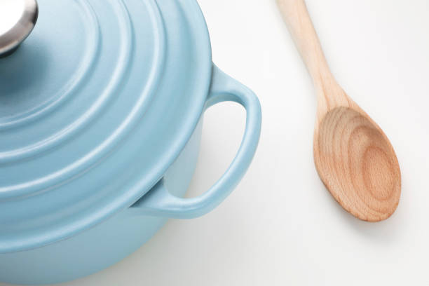 istock Light blue pot and a wooden spoon 1448418178
