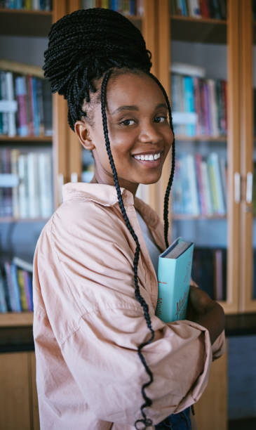 istock Student, black woman and library books university, education and thinking or learning for knowledge, scholarship research. Portrait of young female studying, reading and lifestyle with gen z girl 1448420654
