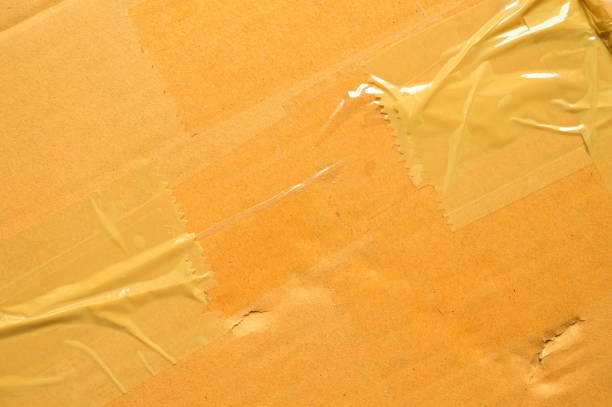 istock brown cardboard paper box, paper textured background 1448420668