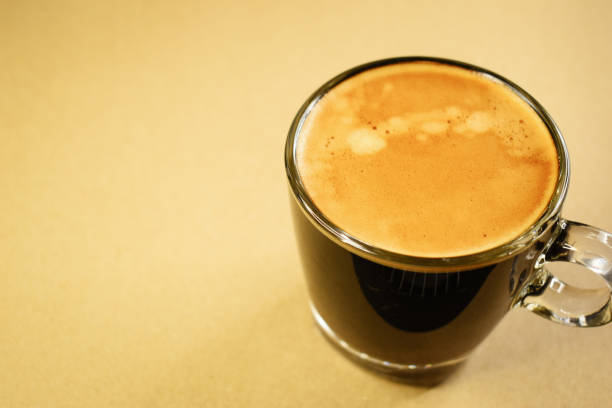 istock black coffee put on brown background, beverage in the morning 1448420847