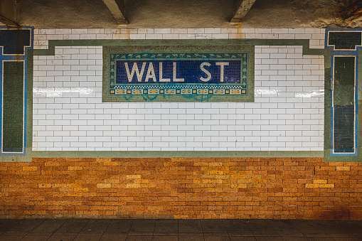 Mosaic subway tiles at the Wall Street subway station in New York City