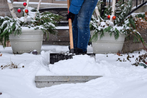 istock Man shoveling snow during snowfall 1448425374