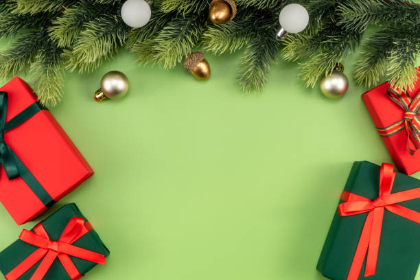 istock Christmas composition. Christmas gifts and decorations on green background. 1448428693