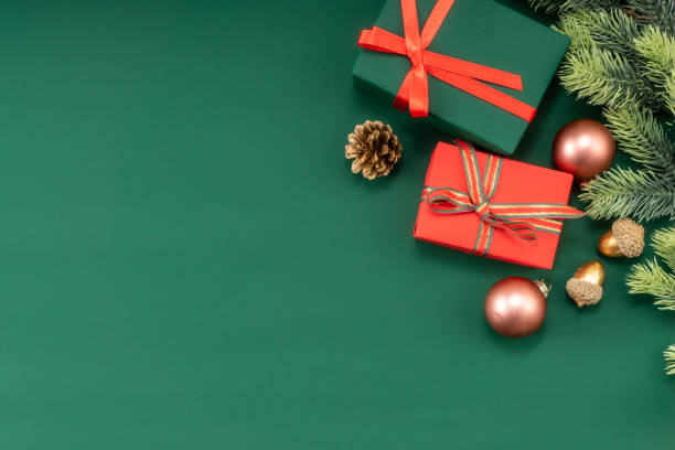 istock Christmas composition. Christmas gifts and decorations on green background. 1448428706