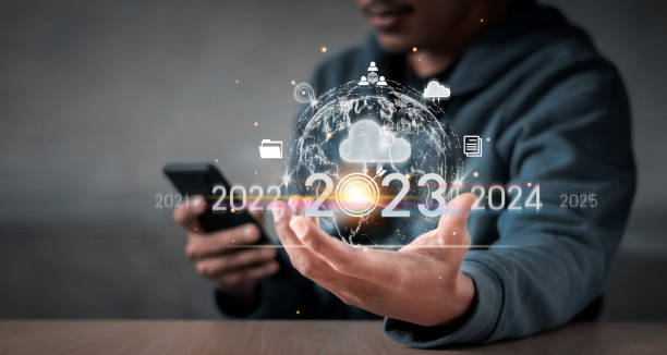 Businessman Hand holding virtual Global.positive indicators in 2023, businessman calculates financial data for long-term investments. stock photo