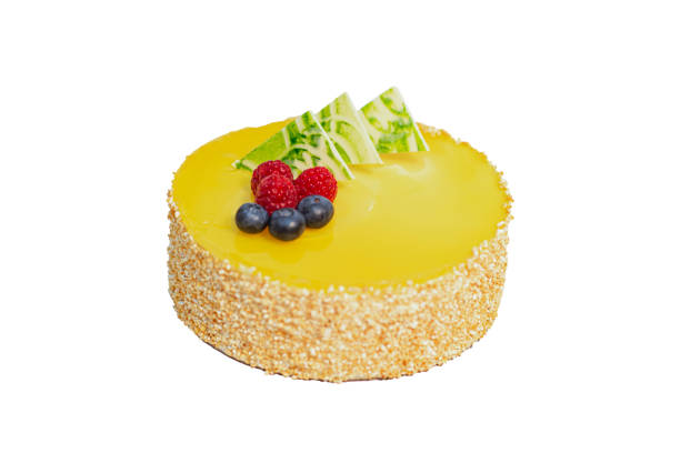 istock Mango mousse cake, light filling of fruit mousse and sponge layers, with a shortbread base, garnished with fruit jelly and croquant 1448445414