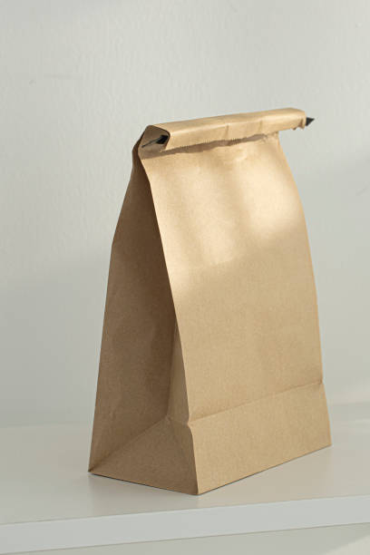 istock Brown kraft paper bags isolated on white background. 1448451384