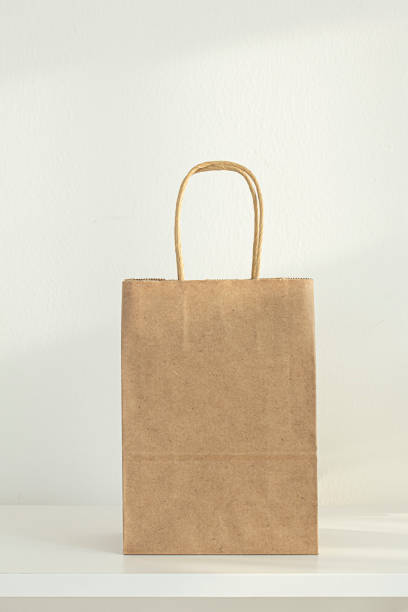 istock Brown kraft paper bags isolated on white background. 1448451502