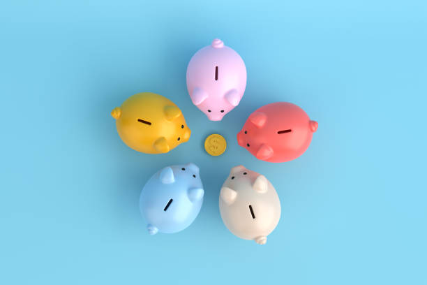 istock Economic breakdown, savings reduction and financial crisis. Economic wealth distribution problem. Colorful piggy banks gathered around a gold coin. 1448454053