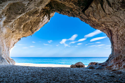 The view out of one of the many seaside caves at the beach of Cala Luna in Sardinia