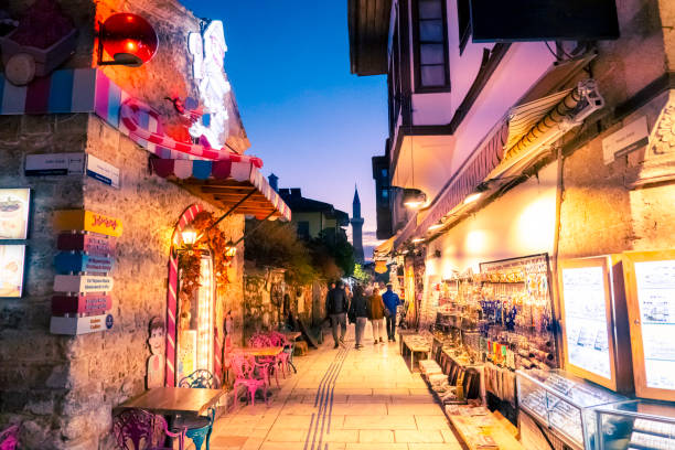 Antalya, Turkey - 12/03/2022: A street photo showing the illuminated streets and classical architecture of Antalya Old Town as New Year's Eve approaches.
