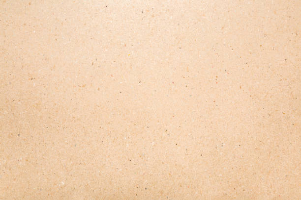 istock Light brown carton background. Closeup. Material for products packaging. Empty place for text. Top down view. 1448465038