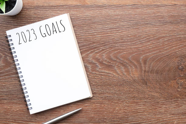 istock Notebook with 2023 goals text on it to apply new year resolutions and plan. 1448467102