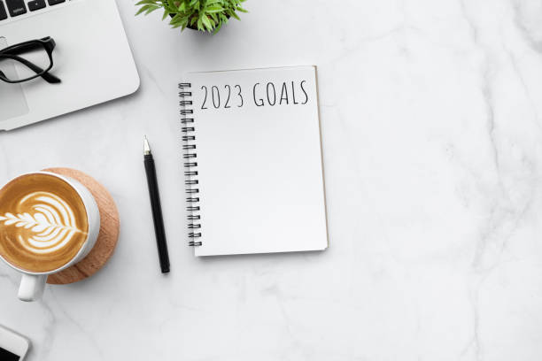 istock Notebook with 2023 goals text on it to apply new year resolutions and plan. 1448467124