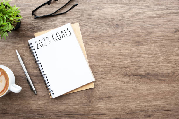 istock Notebook with 2023 goals text on it to apply new year resolutions and plan. 1448467149