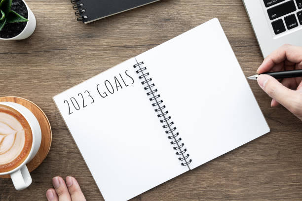 istock Notebook with 2023 goals text on it to apply new year resolutions and plan. 1448467209