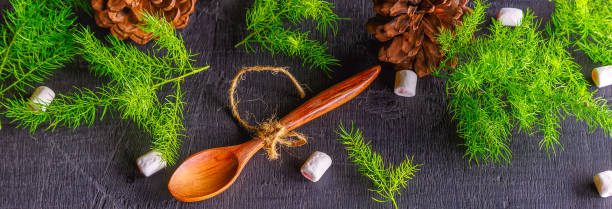 istock Wooden spoon and pine tree background Christmas background concept 1448467382