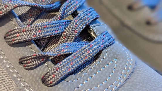 Close up of grey, winter boots and laces