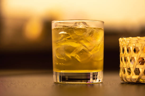 istock A glass of whisky and ice on table 1448469683