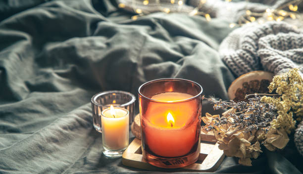 istock Cozy home composition with candles in bed. 1448469794