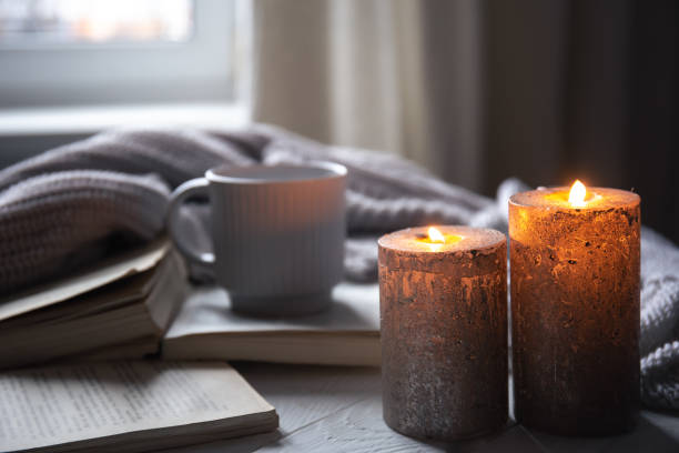 istock Cozy home composition with candles on a blurred background. 1448470718