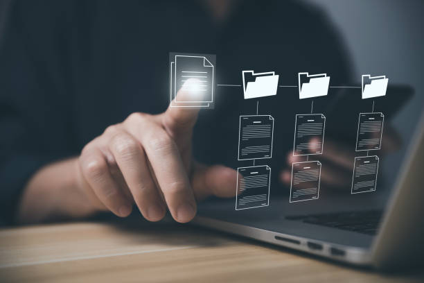 istock Businessman working on laptop and smartphone electronic document management 1448472395