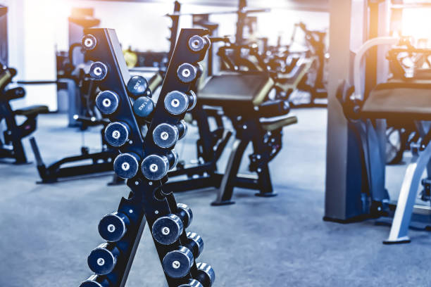 istock rows with a set of dumbbells 1448472422