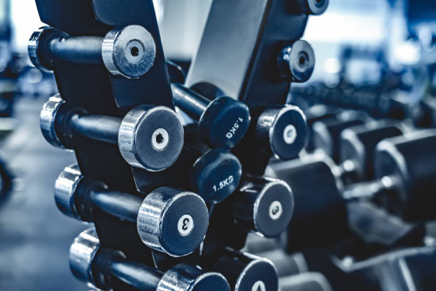 istock rows with a set of dumbbells 1448472431