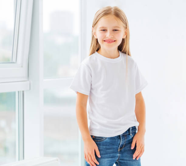 istock Little girl in new white clothes 1448473254