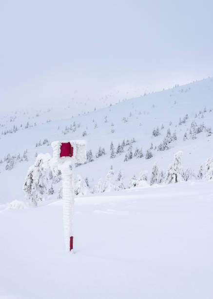 istock Snow covered red sign on the mountainside. 1448473618