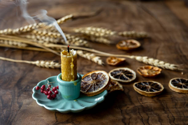 istock Extinguished candle smoke on wood table in autumn 1448474899