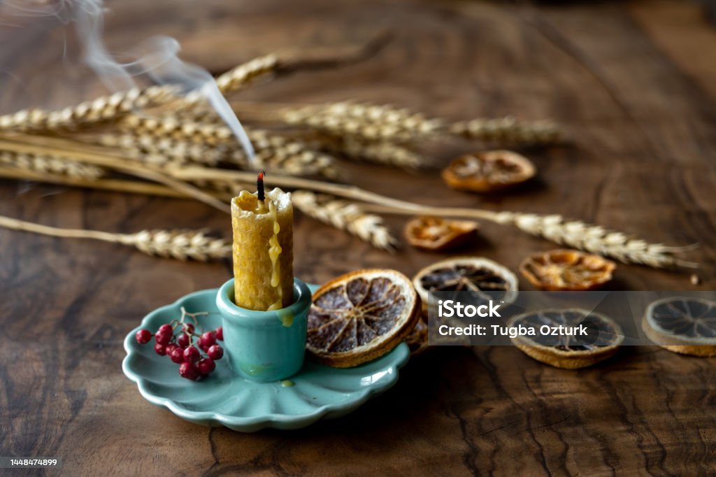 Extinguished candle smoke on wood table in autumn beeswax candle Autumn Stock Photo