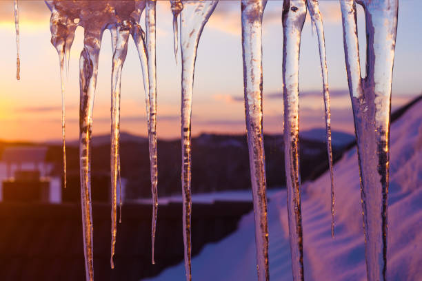 istock Icicles hanging from the roof in winter sunset 1448475080