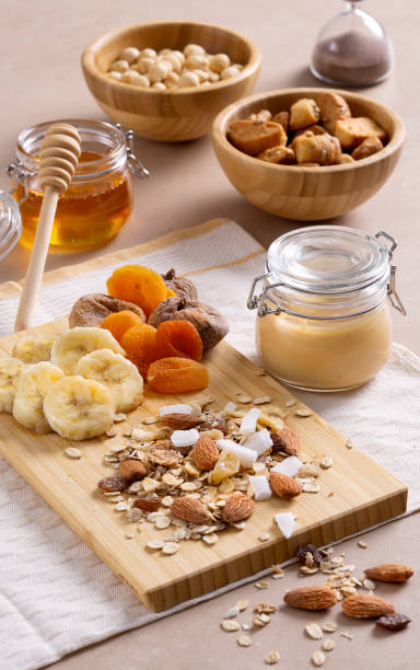 istock Various nuts placed on the table with honey,banana slices and dried apricots 1448475136