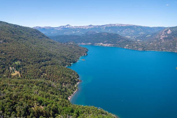 lacar lake is a lake of glacial origin in san martin de los andes. The area around the lake is mostly uninhabited. panoramic view of lacar lake, one of the seven that are located at san martin de los andes, argentina lácar lake photos stock pictures, royalty-free photos & images