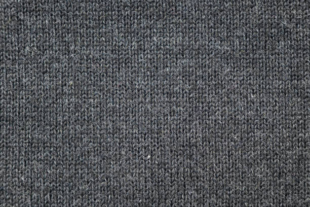 istock Surface of warm winter knitted gray sweater as background or texture, top view 1448476912