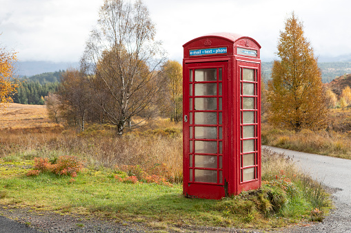 Obsolete run down telephone booth.