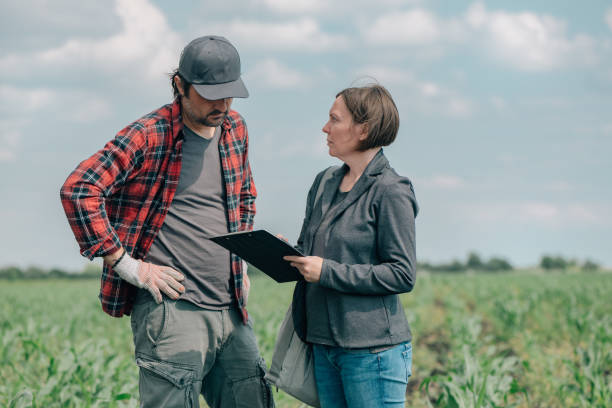 istock Mortgage loan officer assisting farmer in financial allowance application process 1448477513