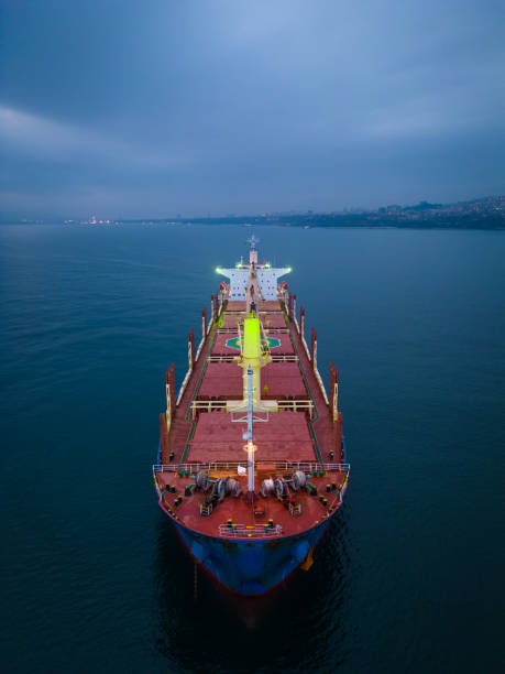Aerial view cargo bulk carrier ship on the sea at night stock photo