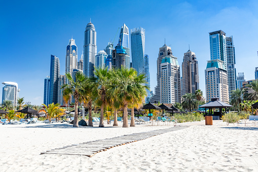 Dubai jumeirah beach with marina skyscrapers in UAE. Popular public JBR beach