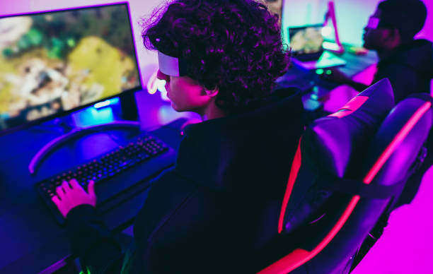 istock Young gamers playing at e-sports competition using vr headset - New technology game trends and entertainment concept - Focus on metaverse glass 1448479604