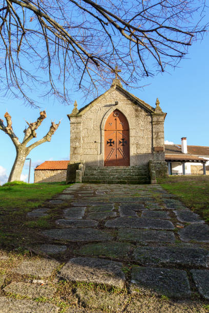 istock old church chapel with pathway and dry tree branches 1448480714