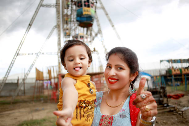 Young woman enjoying in funfair outdoors.