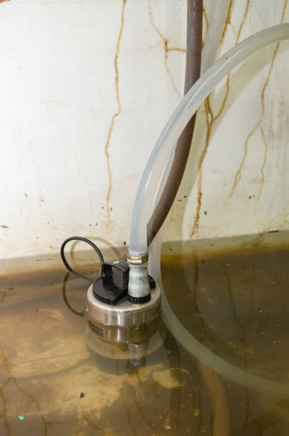 istock A water pump that is pumping water from flooded homes caused by storms. 1448482114