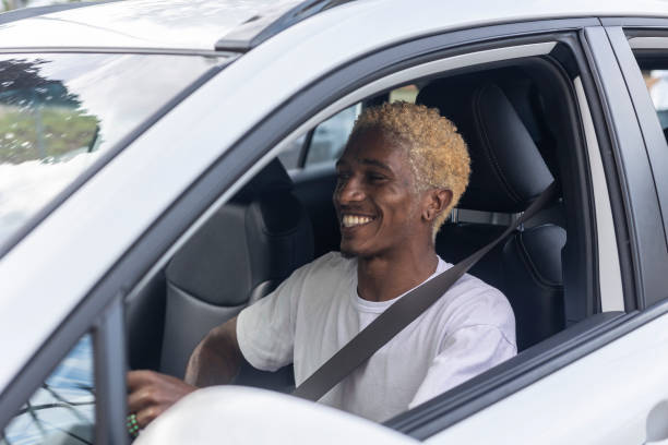 istock Black man getting into car and driving 1448482277
