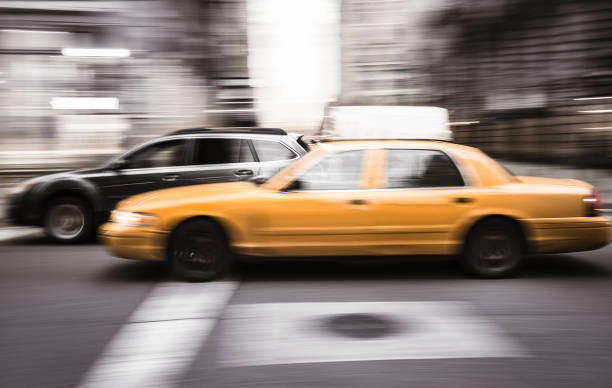 Yellow cab with panning motion in Manhattan, New York City