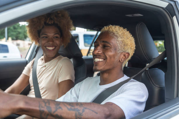 istock Couple in a car driving 1448483698