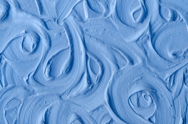 istock Light blue bentonite clay (face cream, alginate facial mask, body wrap, hair conditioner) texture close up, selective focus. Abstract background with circle brush strokes. 1448484370